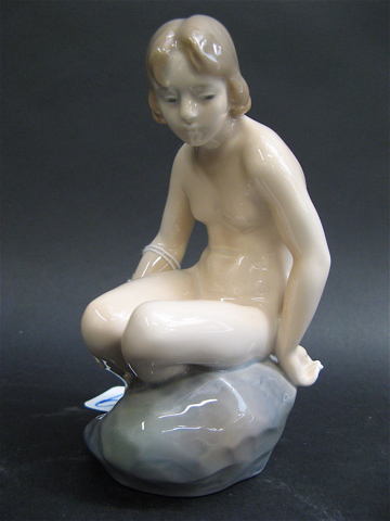 Appraisal: ROYAL COPENHAGEN PORCELAIN FIGURE titled Nude on Rock of a