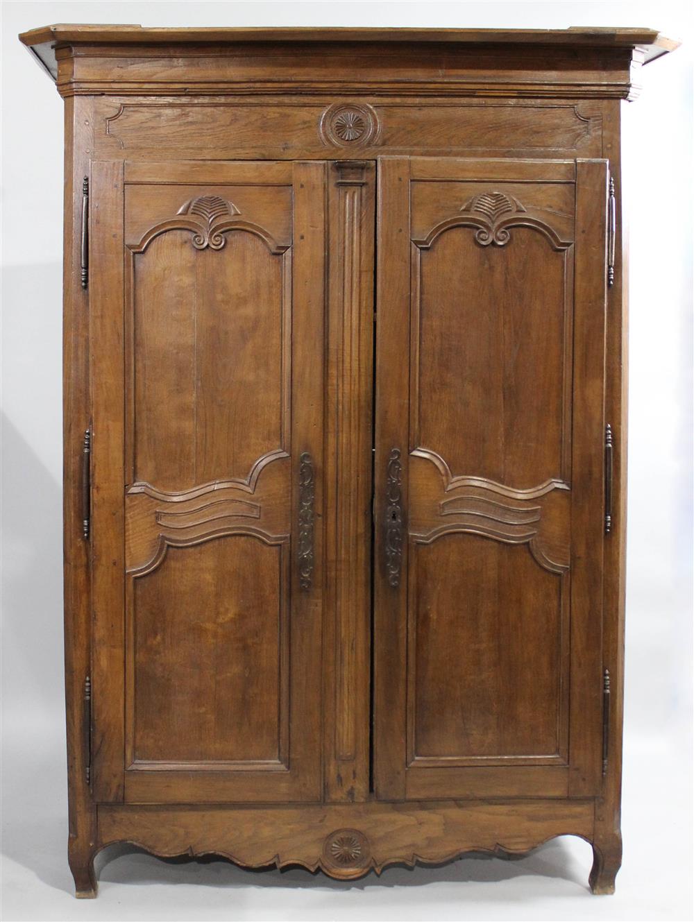 Appraisal: FRENCH PROVINCIAL CARVED WALNUT ARMOIRE rectangular with canted corners and