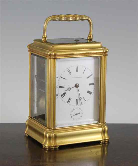 Appraisal: An Edwardian gilt brass hour repeating carriage alarm clock with