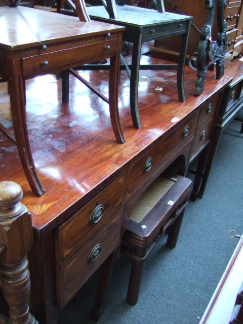 Appraisal: An early th century mahogany sideboard the rectangular top centred