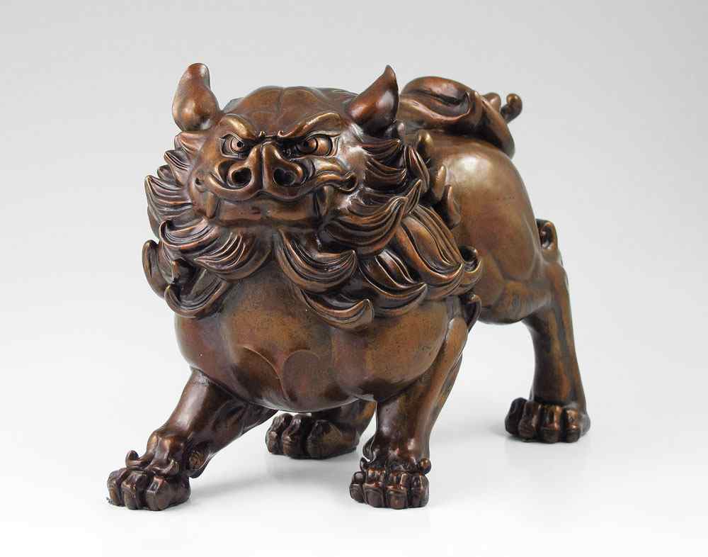 Appraisal: WELL MODELED FEROCIOUS FOO DOG SCULPTURE Patinated Metal possibly bronze