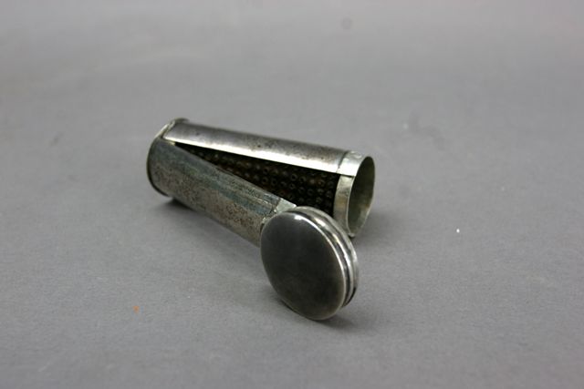 Appraisal: An unusual sterling silver hinged nutmeg grater complete with cylindrical