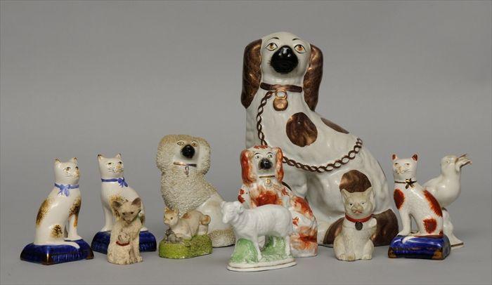 Appraisal: SIX STAFFORDSHIRE SPANIEL POODLE AND CAT FIGURES Together with five