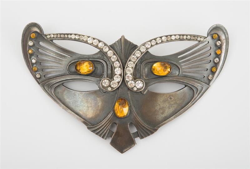 Appraisal: METAL AND GLASS CAT MASK PIN With faceted glass stones