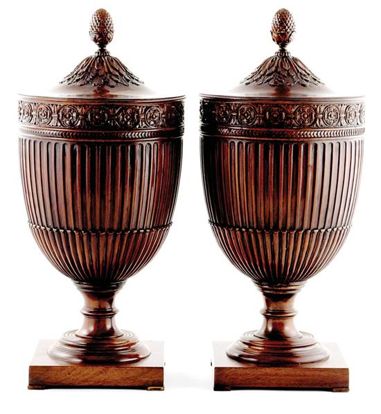 Appraisal: Pair Adam style carved mahogany wine coolers pineapple finial surmounting