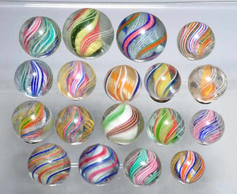 Appraisal: Lot of Multi-Color Swirl Marbles Description Includes nine divided core