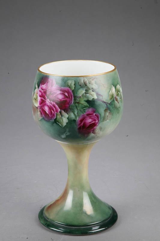 Appraisal: FOOTED VASE Porcelein with handpainted floral decoration and gilt rim