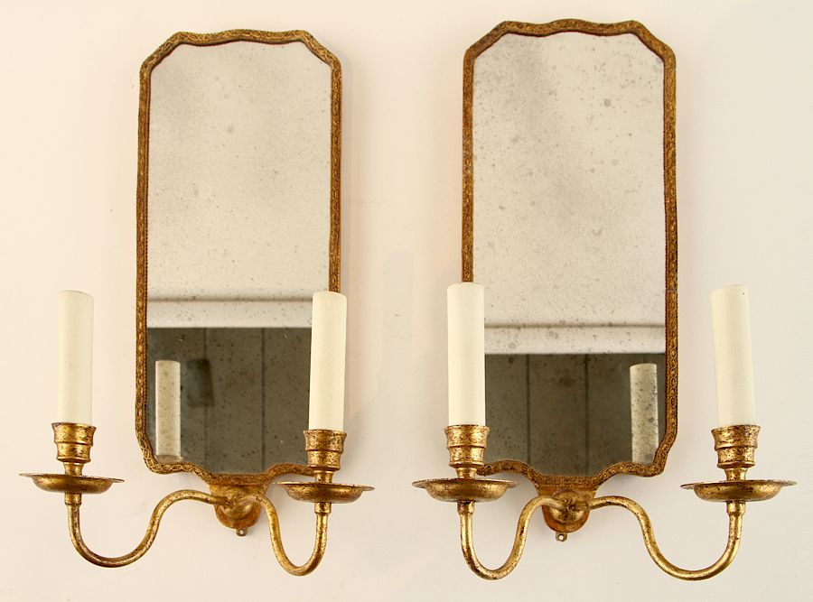 Appraisal: PAIR GILT METAL TWO LIGHT MIRRORED WALL SCONCES A pair