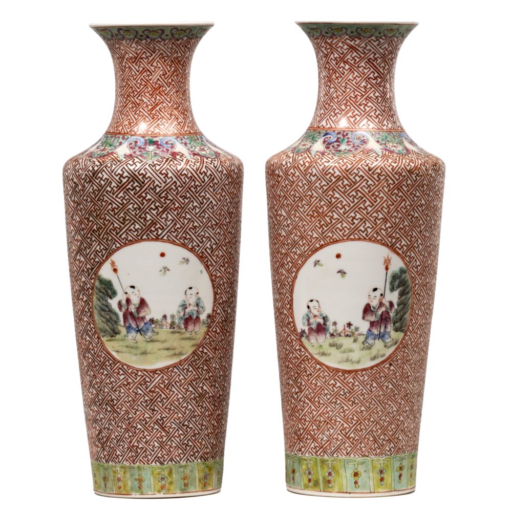 Appraisal: CHINESE VASESMirrored pair having red geometric motif overall with occasional