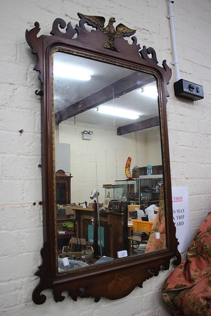 Appraisal: A VICTORIAN MAHOGANY FRET FRAMED RECTANGULAR WALL MIRROR with eagle