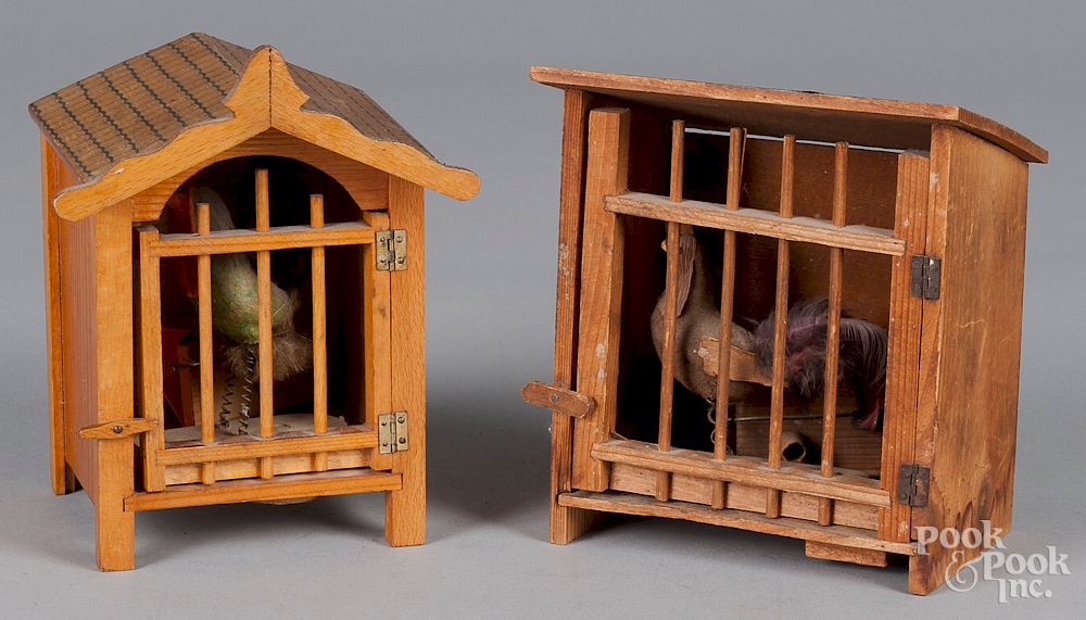 Appraisal: Two rooster in a cage squeak toys Two rooster in