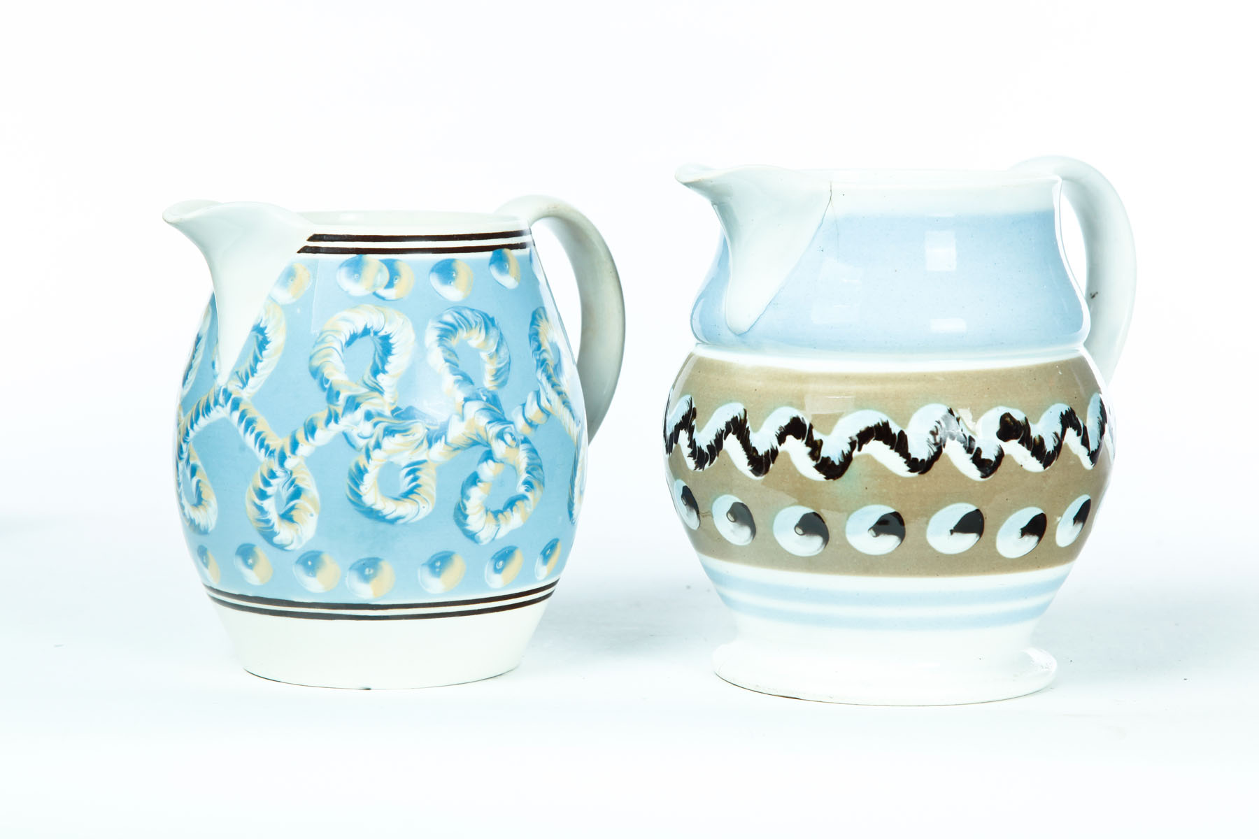 Appraisal: TWO MOCHA PITCHERS England nd quarter- th century Larger has