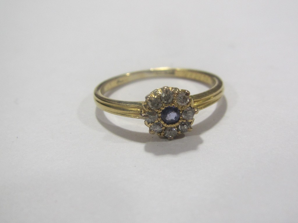 Appraisal: Eighteen carat gold sapphire and diamond flower head cluster ring