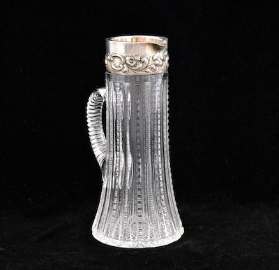 Appraisal: A Cut Crystal Pitcher with Repousse Rim by Dominick Haff