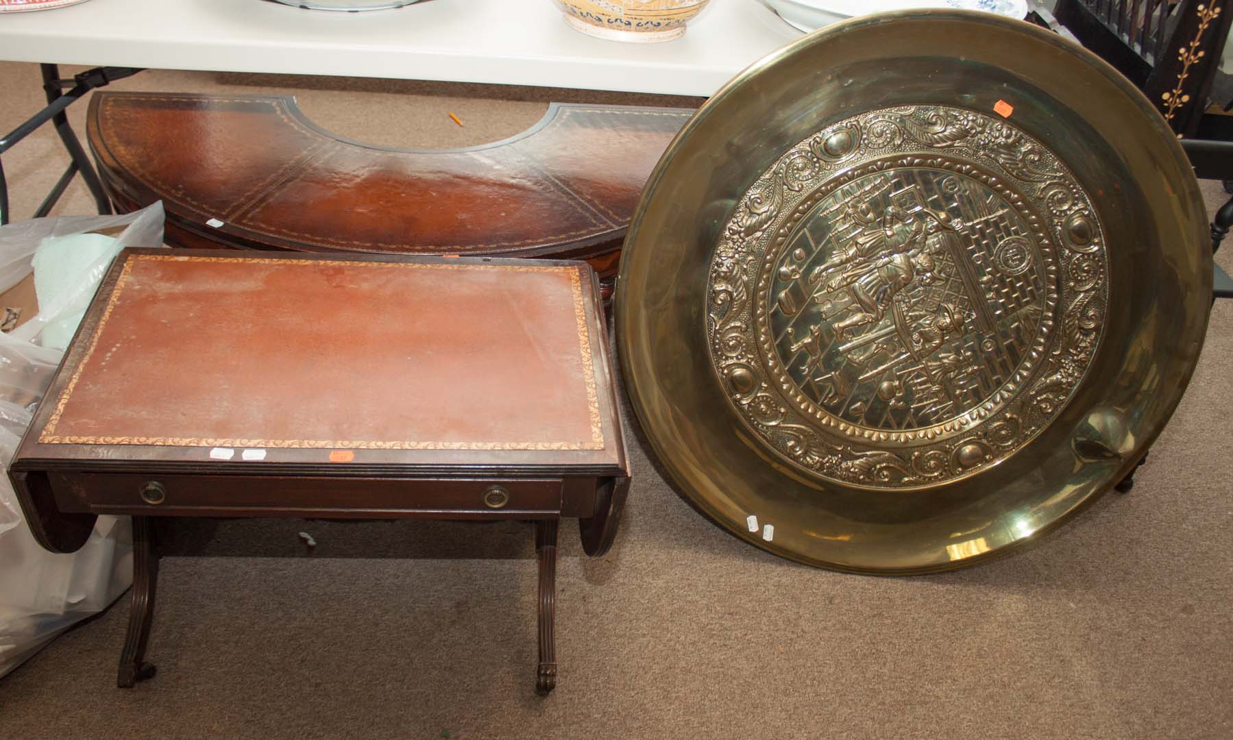 Appraisal: Two leather top coffee tables and a brass tray Undernumber