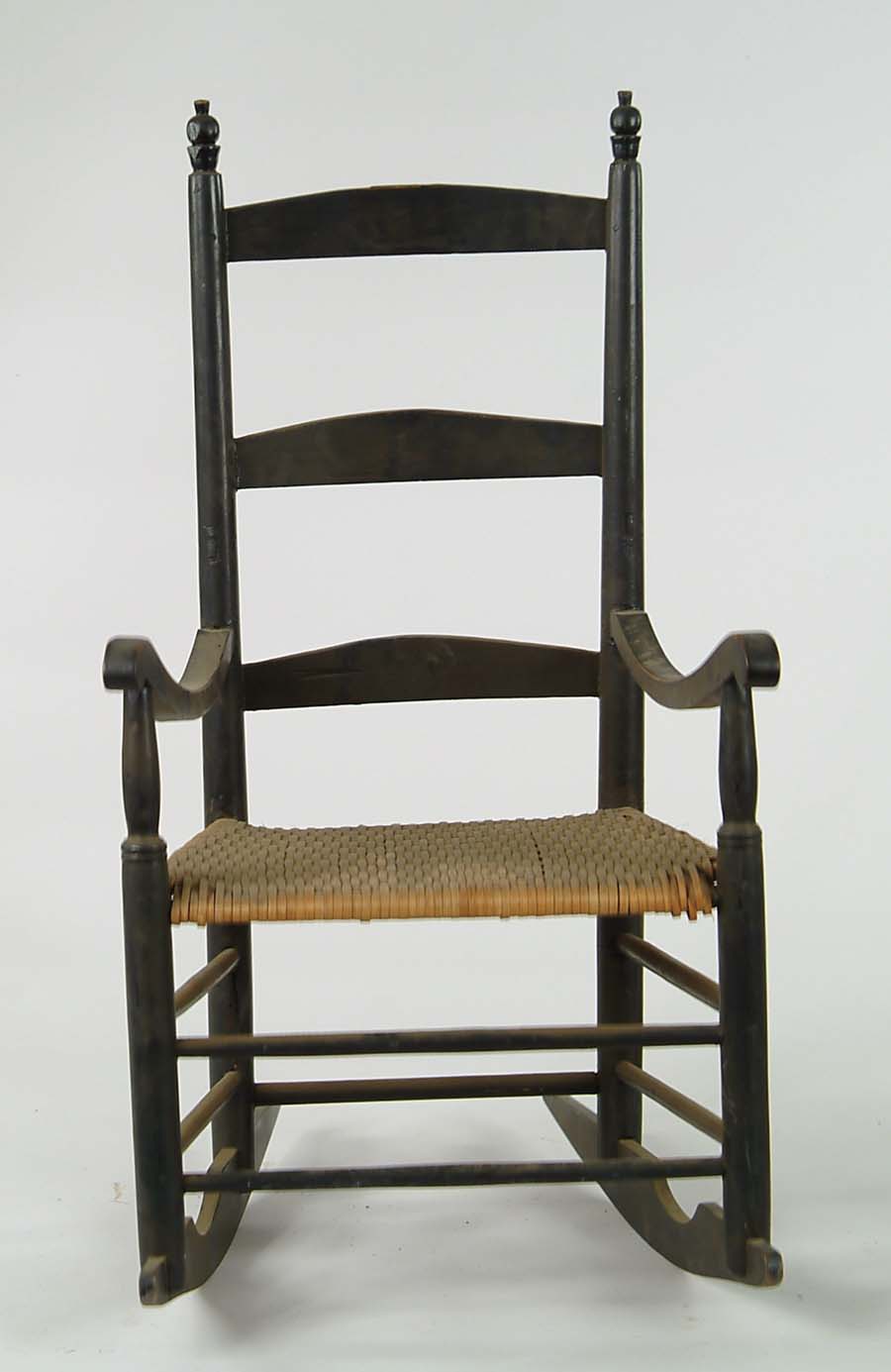 Appraisal: BLACK LADDERBACK ROCKER th th Century Three horizontal slat back