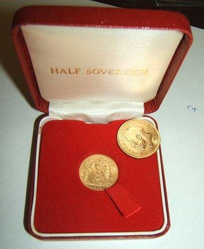 Appraisal: A George V sovereign together with a George V half