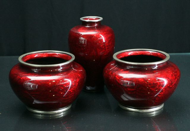 Appraisal: A pair of Japanese cloisonn squat vases in rich red