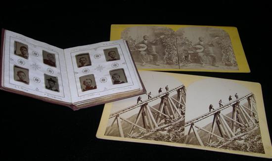 Appraisal: Album of miniature tintypes of children along with two stereoview