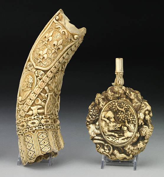 Appraisal: A German carved ivory powder flask and oliphant fragment th