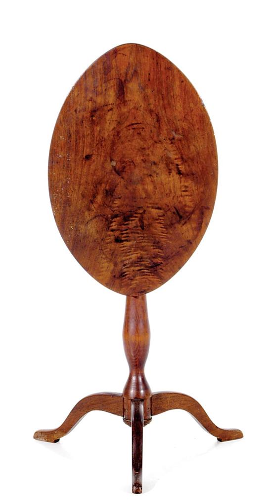 Appraisal: American maple tilt-top candlestand th century oval top over bird-cage