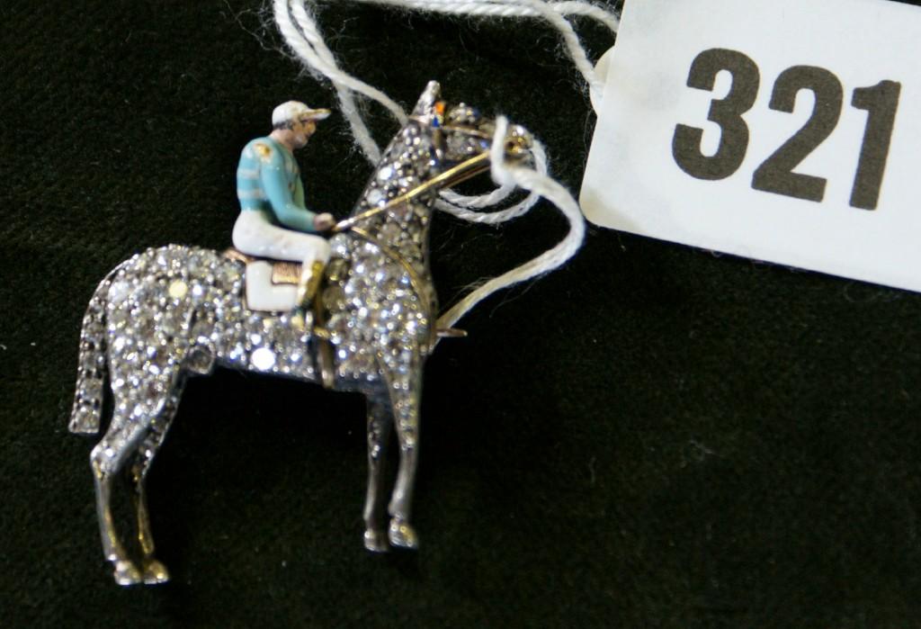 Appraisal: A good diamond horse and jockey brooch circa the standing