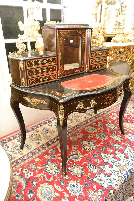 Appraisal: A METAL MOUNTED BOULLE MIRRORED DRESSER WITH LEATHER INSET TOP