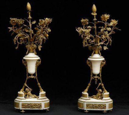 Appraisal: PAIR OF LOUIS XVI-STYLE GILT-BRONZE MOUNTED WHITE MARBLE FOUR-LIGHT CANDELABRA