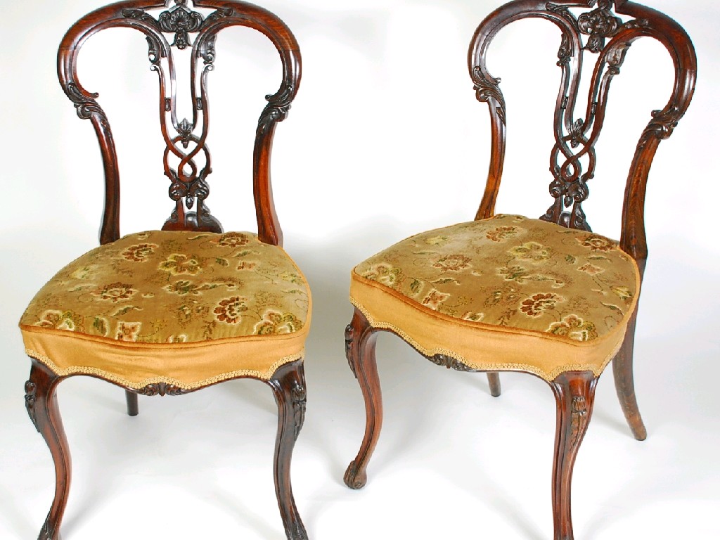 Appraisal: GOOD QUALITY PAIR OF VICTORIAN CARVED ROSEWOOD SINGLE CHAIRS the