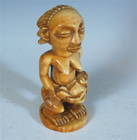 Appraisal: Ethnographic Interest An early th century carved ivory maternity figure