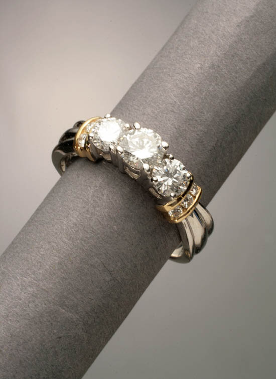 Appraisal: -Karat Yellow and White-Gold Triple-Diamond Dinner Ring The four-prong stepped