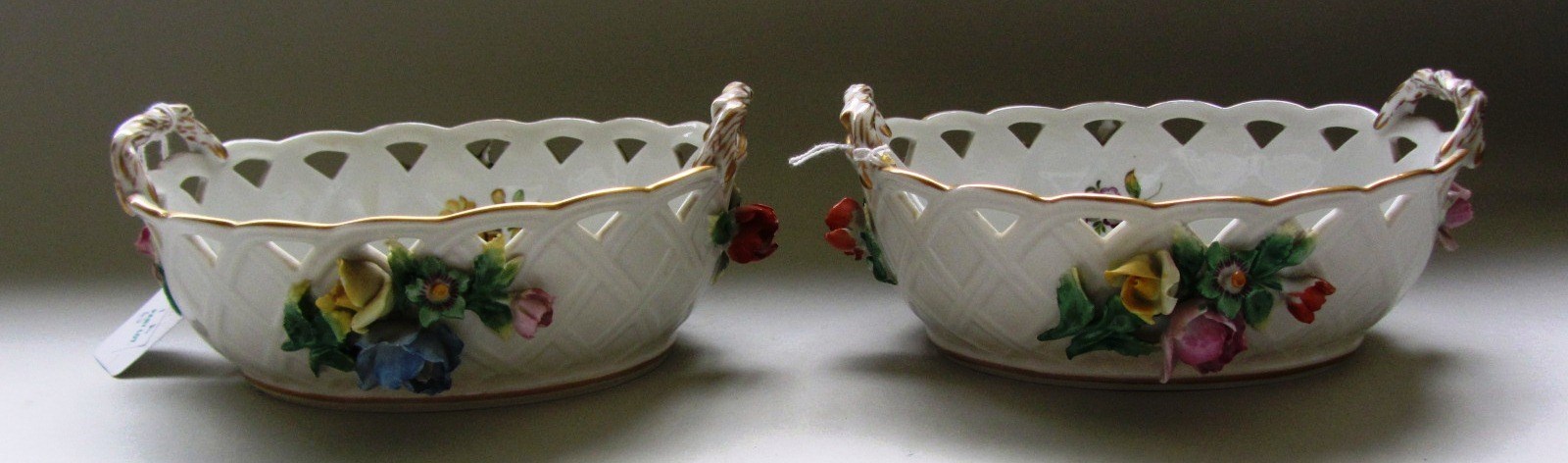 Appraisal: A pair of Dresden two handled porcelain baskets th century