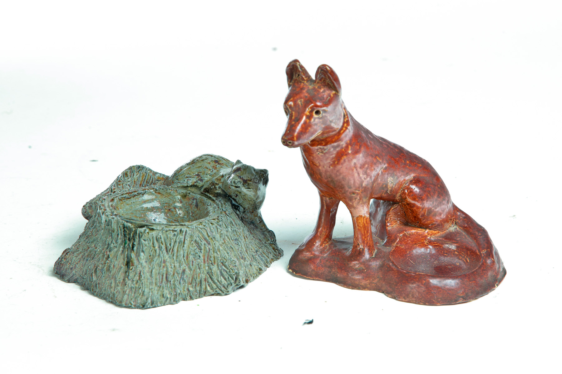 Appraisal: TWO AMERICAN SEWERTILE PIPE STANDS Mid th century Squirrel with