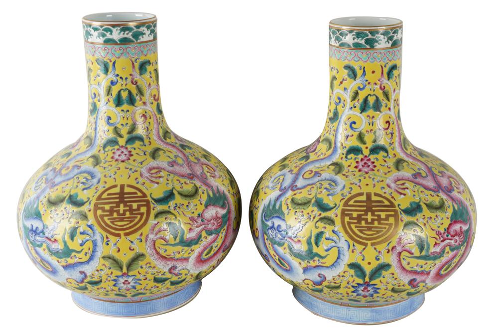 Appraisal: PAIR CHINESE YELLOW-GROUND PORCELAIN DRAGON VASESwith six character mark inches