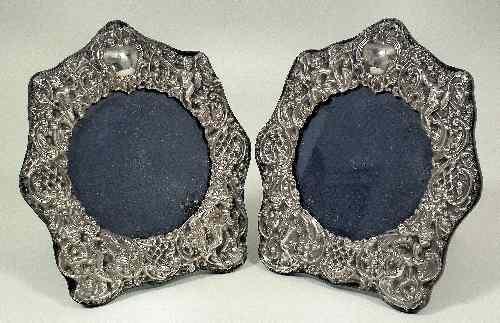 Appraisal: A pair of Elizabeth II silver repousse photograph frames of