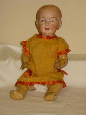 Appraisal: An Eisenmann Co bisque head baby character doll with painted