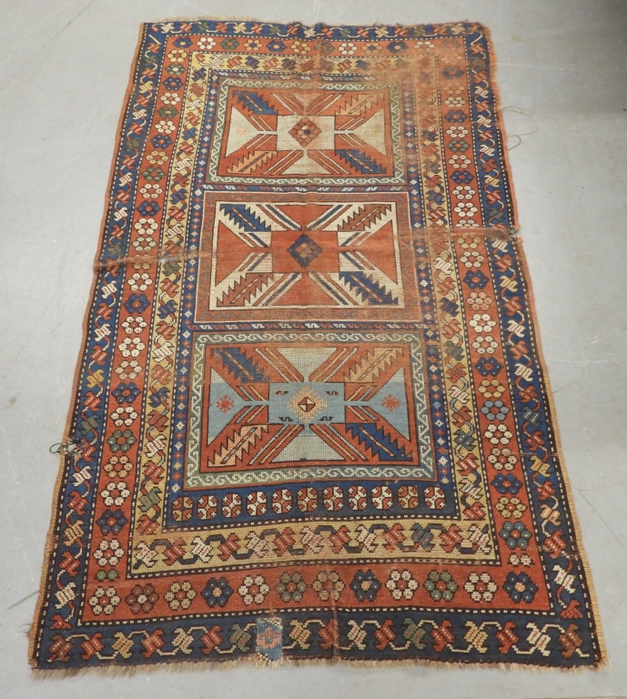 Appraisal: UNUSUAL GEOMETRIC KAZAK RUG Middle East th CenturyRed navy blue