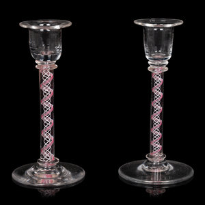 Appraisal: A Pair of Internal Twist Glass Candlesticks th Century Height