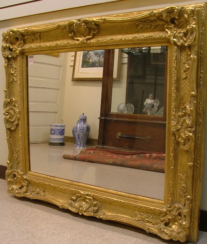 Appraisal: A RECTANGULAR WALL MIRROR in the Italian taste having wide