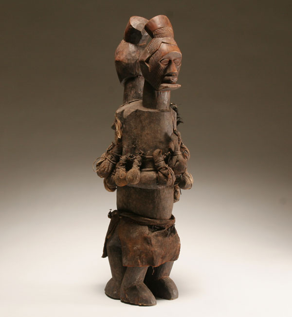 Appraisal: African Yaka carved wooden Janus figure with fetish pouches Democratic