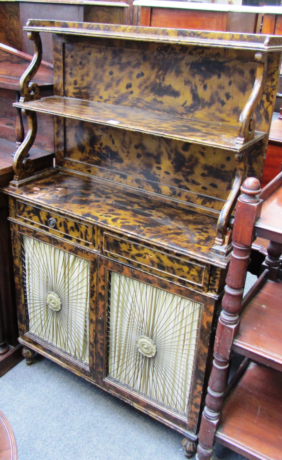 Appraisal: A Regency style faux tortoiseshell double ledge back chiffonier with