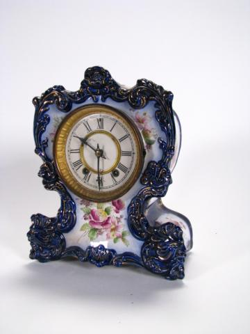 Appraisal: Waterbury antique china mantle clock high with floral decor on