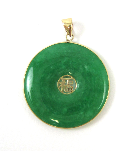 Appraisal: CHINESE JADE AND FOURTEEN KARAT GOLD PENDANT with a translucent