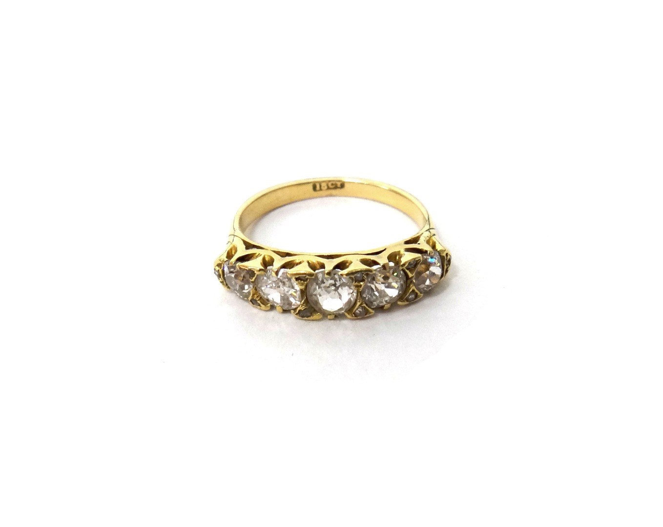 Appraisal: A gold and diamond set five stone ring mounted with