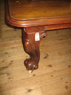 Appraisal: A VICTORIAN MAHOGANY EXTENDING DINING TABLE of rounded oblong form