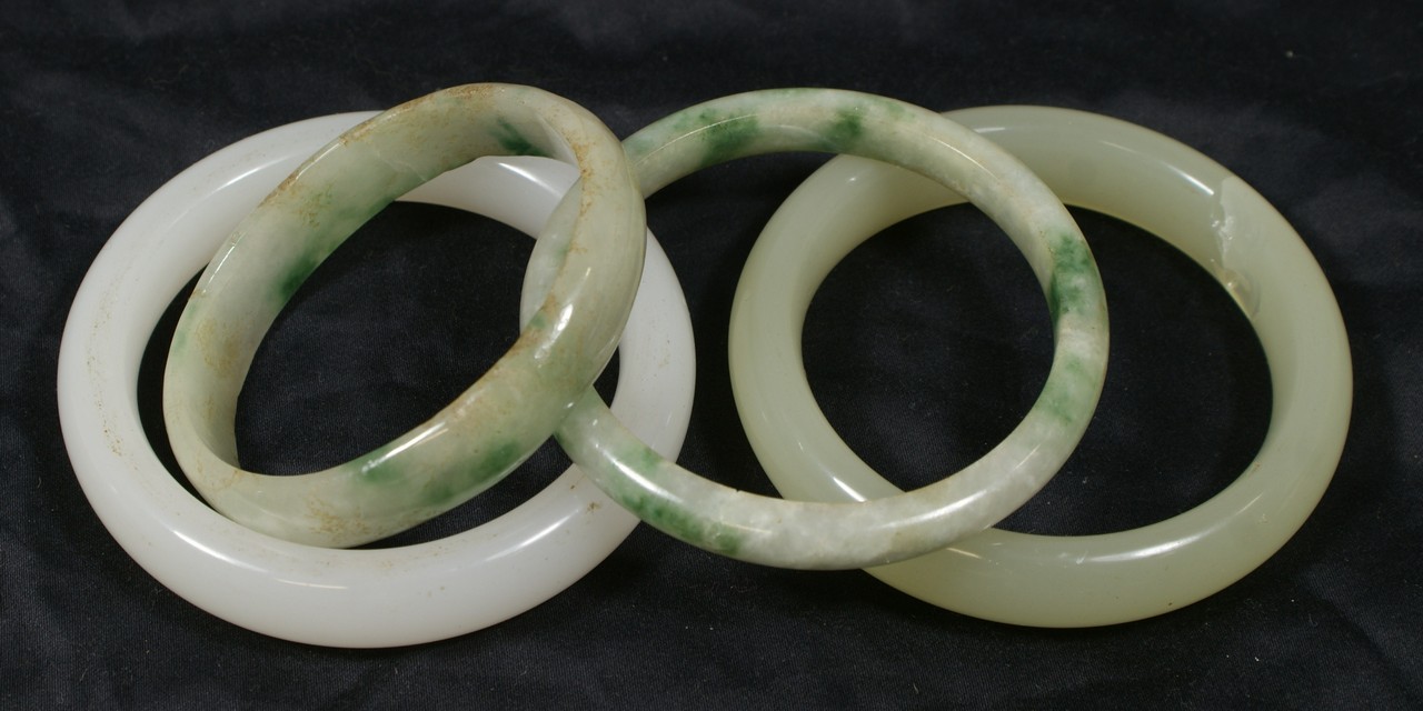 Appraisal: jade bangle bracelets typically id largest od large pale green