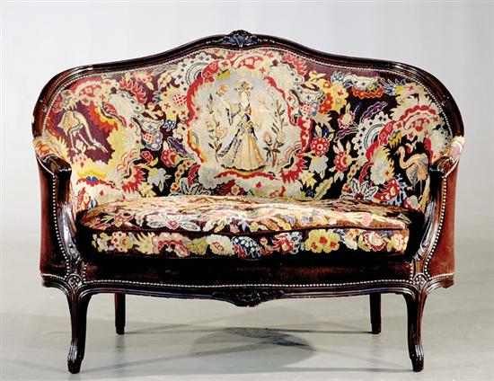 Appraisal: French carved mahogany and needlepoint loveseat late th century bead-and-channel