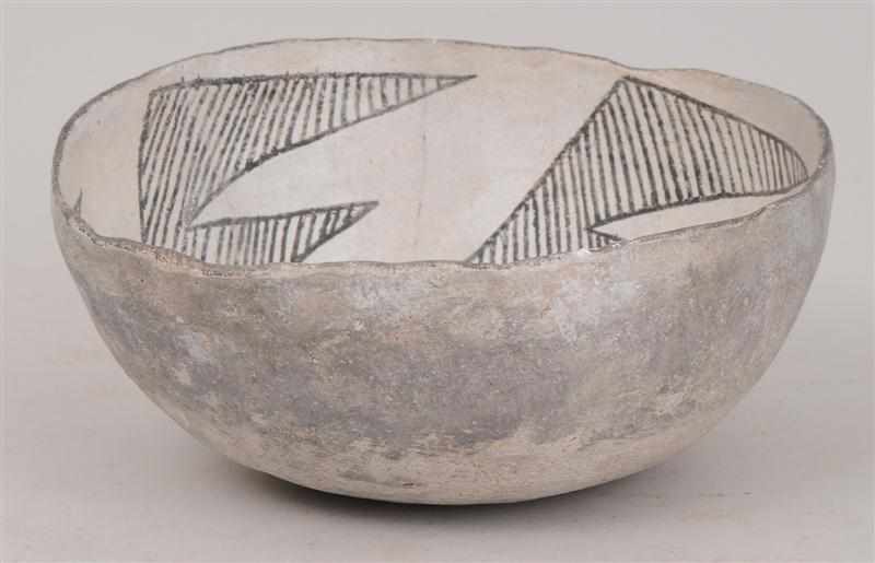 Appraisal: SOUTHWEST INDIAN WHITE-GROUND POTTERY BOWL The interior with four leaf