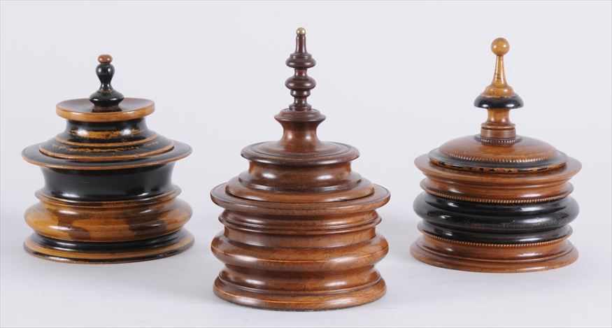 Appraisal: THREE DUTCH BAROQUE TOBACCO JARS AND COVERS In walnut and