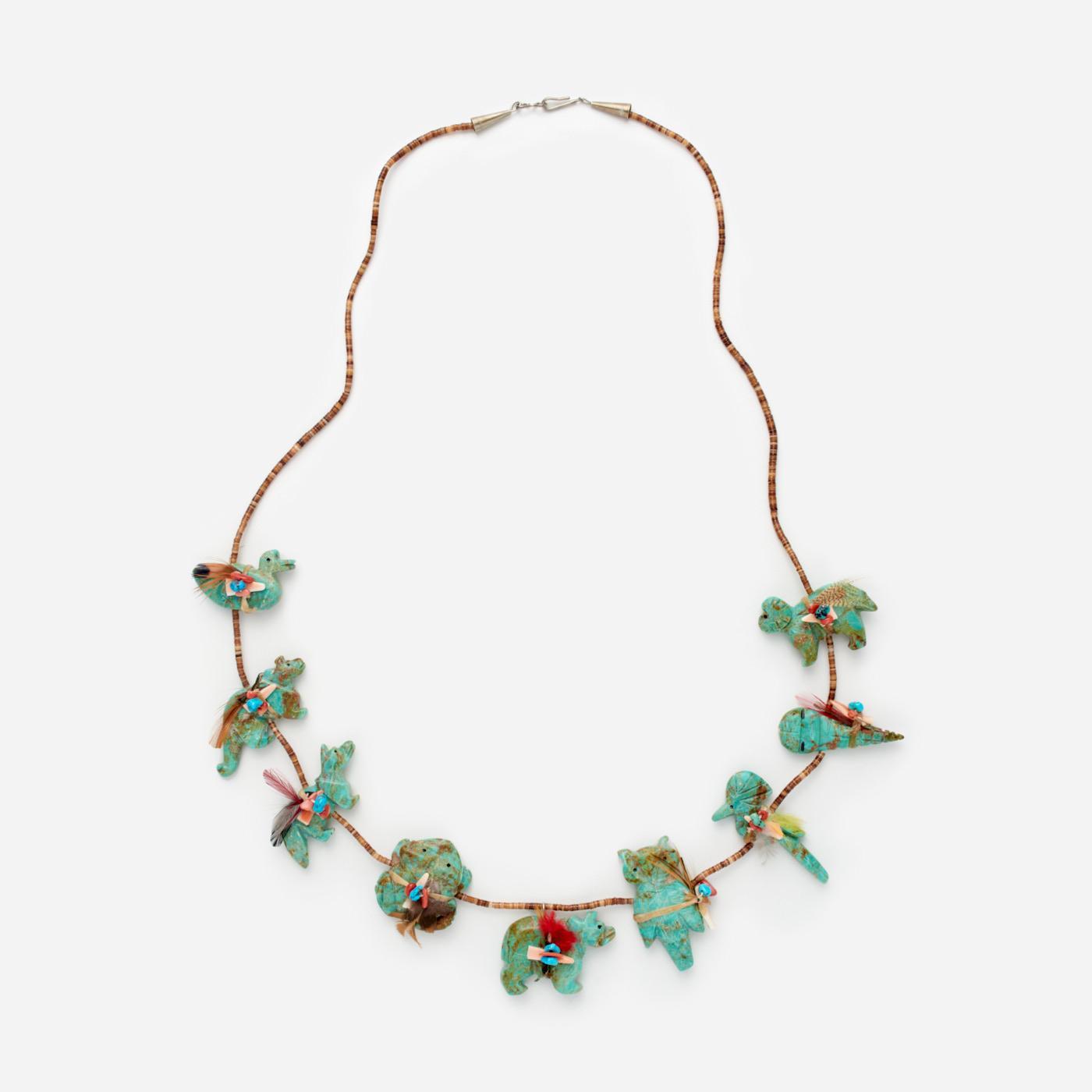 Appraisal: TURQUOISE FETISH HEISHI BEAD NECKLACE A heishi shell strand featuring